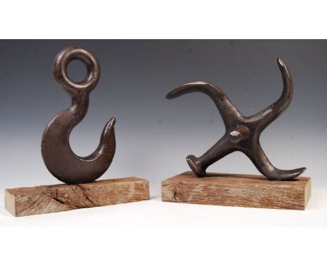 A pair of 20th century retro vintage nautical themed cast metal heavy&nbsp; doorstops in the form of a four point ships ancho