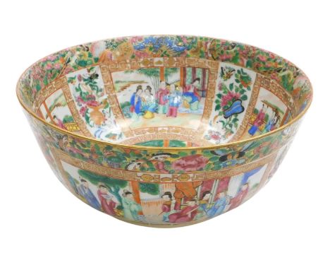 A Qing dynasty Chinese export famille rose porcelain bowl, decorated with reserves in interiors and garden settings, within a
