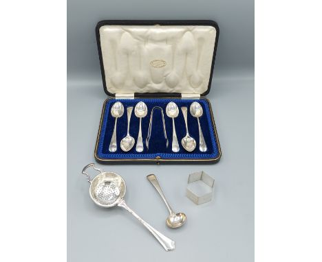 A set of six Sheffield silver teaspoons with tongs in fitted case together with a Birmingham silver tea strainer, a Birmingha