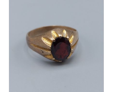 A 9ct gold signet ring set with oval Garnet, ring size T, 4.6gms 