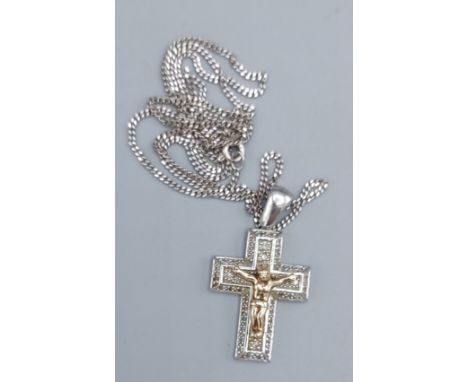 A 9ct white gold crucifix pendant set with diamonds, together with a 9ct gold chain, 9.9gms 