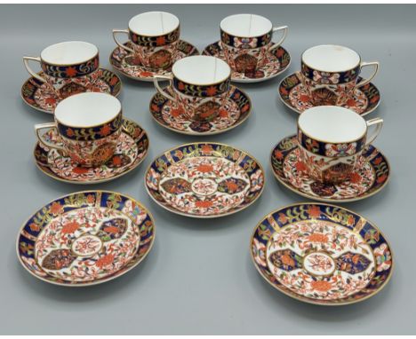 A Royal Crown Derby coffee service comprising seven cups and ten saucers all decorated in the Imari pallette 