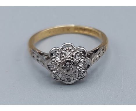 An 18ct gold Diamond set cluster ring, ring size M, 3.1gms 