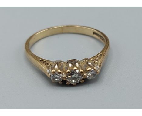 A 9ct gold three stone diamond ring, ring size L, 1.7gms 