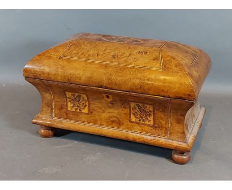 A 19th Century Tonbridge ware tea caddy with Berlin Tapestry panels, the hinged top enclosing two lidded boxes raised upon lo