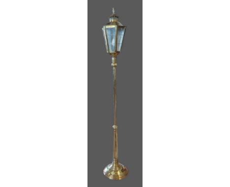 A brass lamp standard in the form of a lantern with circular base, 180cms tall 