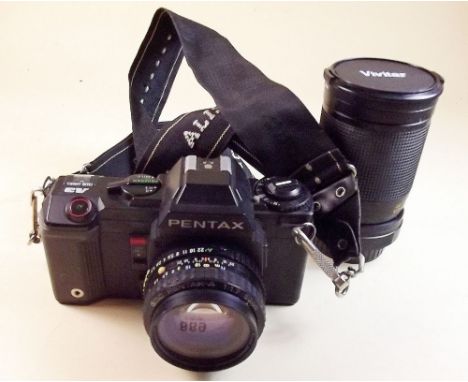 A Pentax camera and Vivitar macro zoom lens - 28 - 85mm