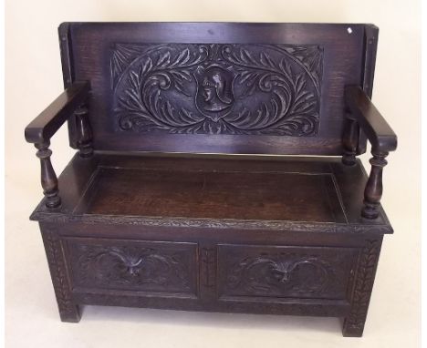 A small early 20th century oak monks bench - 110cm wide