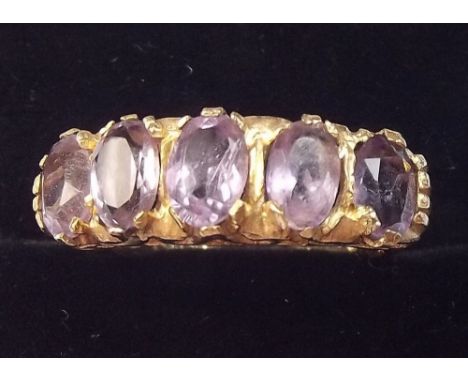 A 9 carat gold amethyst five stone ring