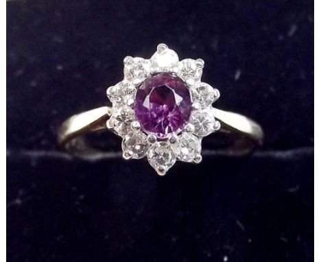 An 18ct gold ruby and diamond cluster ring - Size Q 1/2