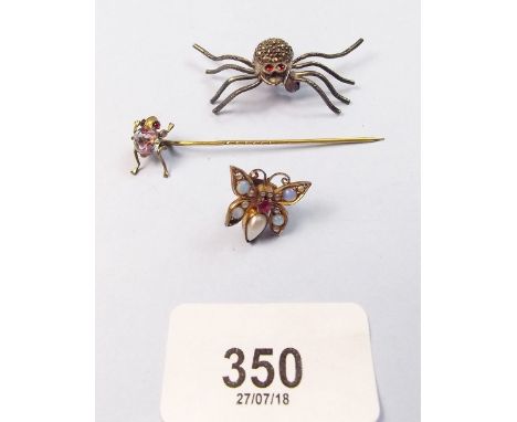 A silver and marcasite spider brooch, a frog stick pin and a jewelled butterfly