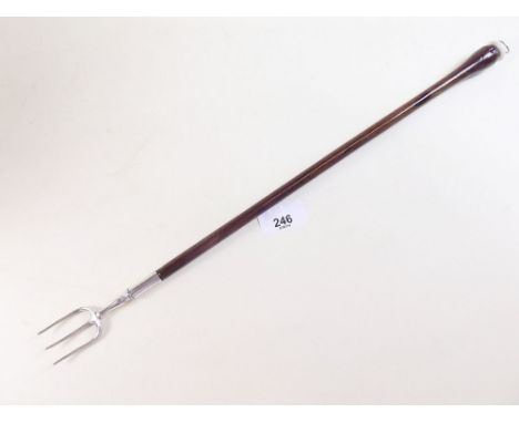 A Victorian white metal and mahogany toasting fork