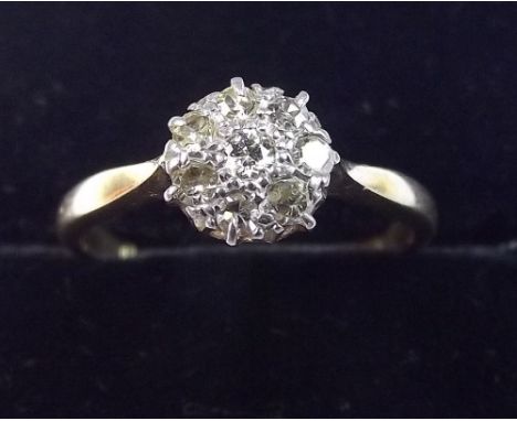 An 18 carat gold diamond cluster ring