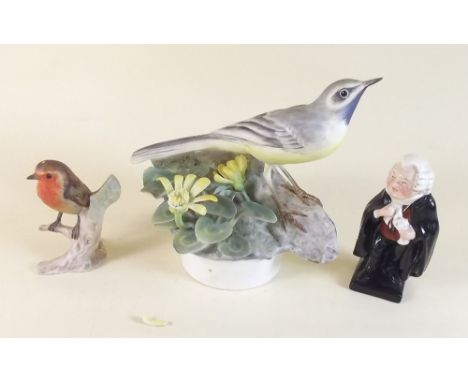 A Royal Worcester grey wagtail with celandine a/f, a Goebel robin, a Doulton figure Buzfuz