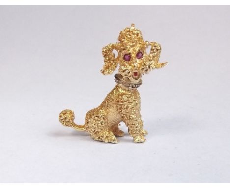 A 14 carat gold brooch in the form of a poodle set ruby eyes and tongue - approx 6.3g and 3cm tall