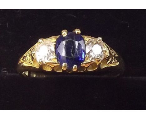 An 18ct gold sapphire and diamond ring - Size M