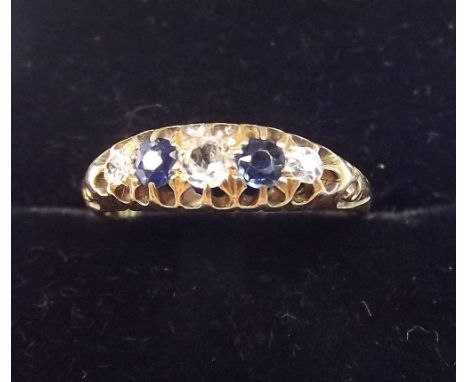 An 18 carat gold sapphire and diamond ring