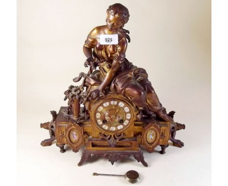 A gilt metal mantel clock with classical woman to top over porcelain inset dial and panels, dial a/f - by Marc of Paris, 36cm
