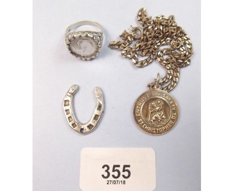 A silver St Christopher pendant necklace with a silver horse shoe lucky charm and a silver ring with inset coin