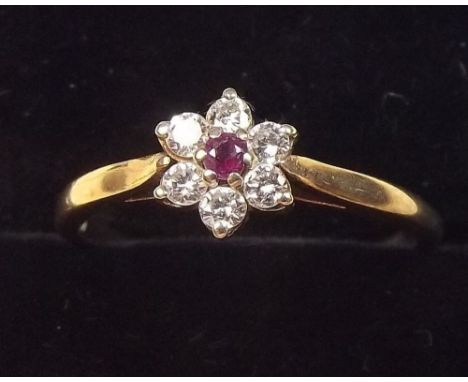 A 9ct gold ruby cluster ring - Size P 1/2