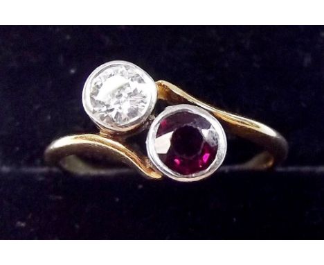 An 18t gold ring crossover set ruby and diamond - Size M