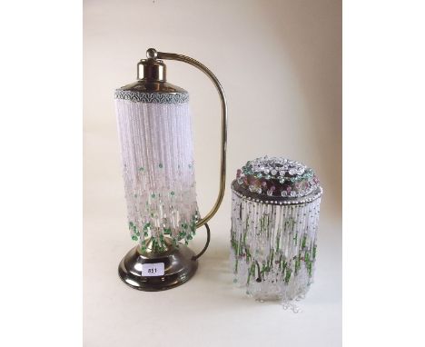 A brass table lamp with glass bead shade, and another similar shade