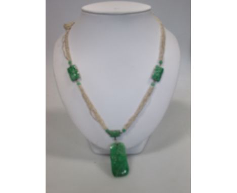A jade and seed pearl necklace, the multi-strand seed pearl necklace fitted with rectangles of carved and pierced jade on whi