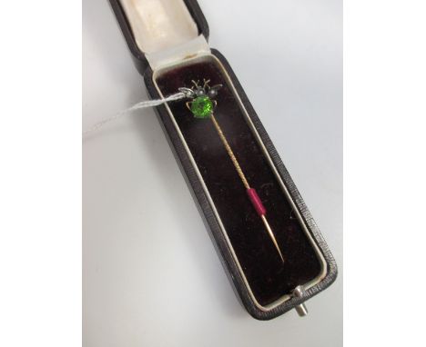 A green hardstone and split pearl fly stick pin set in unmarked yellow metal, cased  