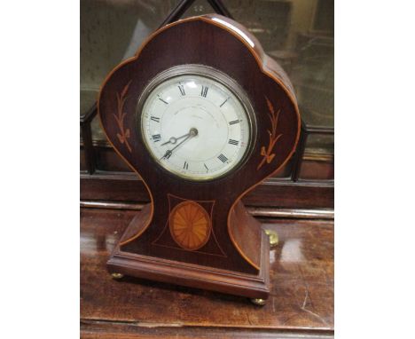 An Edwardian mantel clock with inlaid decoration  
