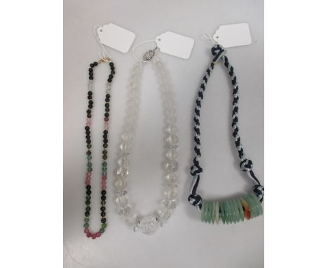 A multi colour tourmaline bead necklace with 14k clasp, a rock crystal bead necklace with silver T-bar clasp and a jade bi ne
