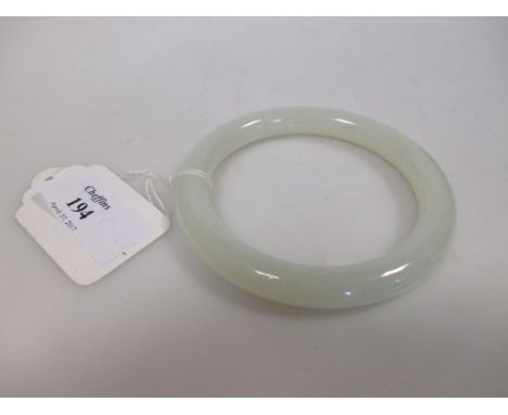 A jade bangle, 8cm aperture  