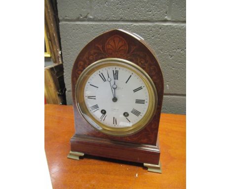 An Edwardian mahogany arched mantel clock 'Benson Ltd', 24cm high  