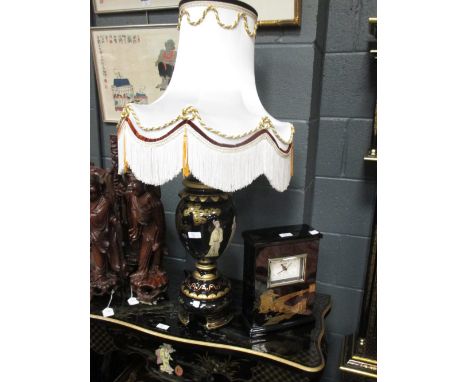 A Chinese black ground lamp and chinoiserie mantle clock (2)  