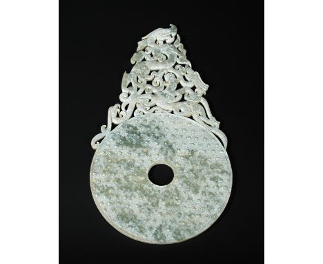 A Chinese calcined nephrite jade winged bi, 28cm (11 in) wide  