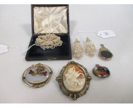 A seed pearl brooch (cased) and a pair of similar seed pearl earrings, together with an oval shell cameo in gilt metal mount,