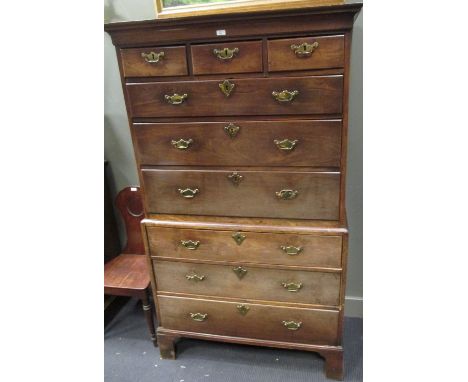 A George III mahogany chest on chest, the upper part with cavetto cornice, fitted three short and three long drawers, the bas