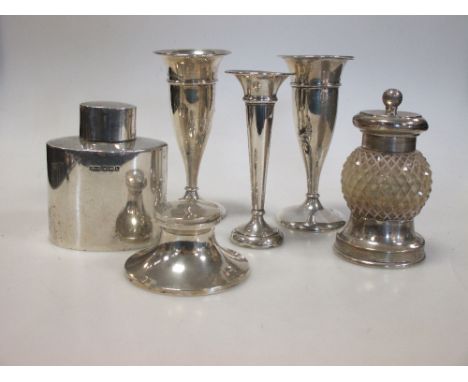 A silver tea cannister, a pair of small spill vases, a pepper grinder (6) etc  