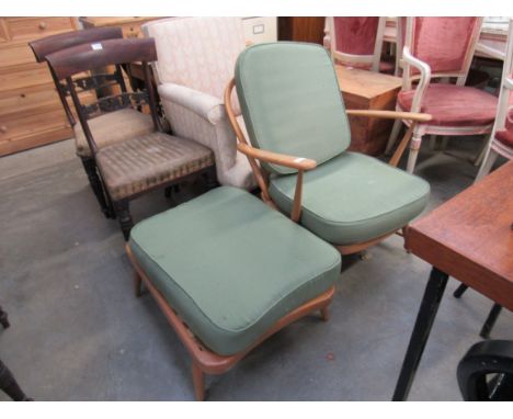 An Ercol easy chair and footstool