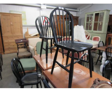 Four black painted stick back chairs 