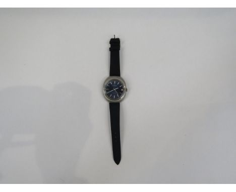A Jaeger LeCoultre Master Quartz stainless steel cased gent's wristwatch of oval form with brushed/grained finish to case, bl