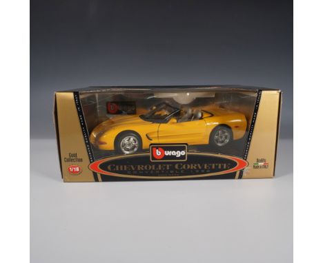 A Burago 1:18 scale die-cast model of the 1998 Chevrolet Corvette Convertible, part of the Gold Collection series. This metic