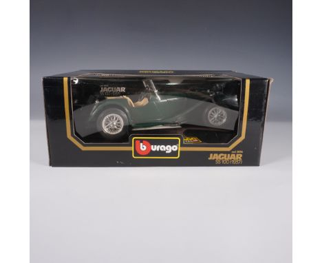 A highly detailed 1:18 scale die-cast model of the classic 1937 Jaguar SS 100 by Bburago. This collectible model features a d