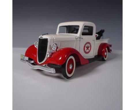 A finely detailed Solido diecast model of a 1936 Ford V8 pickup truck, featuring a classic Texaco Gasoline Motor Oil livery i