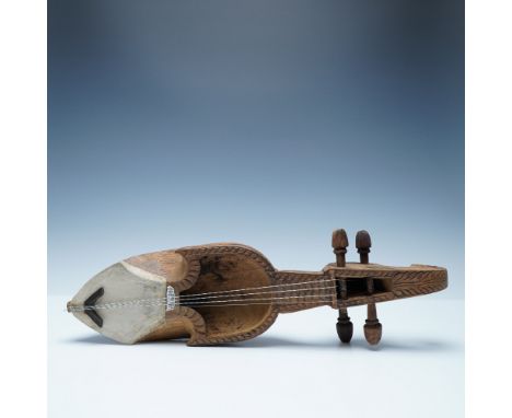 A traditional hand-carved wooden Sarangi from Nepal, a folk string instrument deeply rooted in Nepalese and Himalayan musical