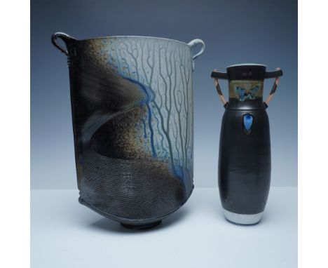 A striking pair of signed studio art pottery vases, each exhibiting masterful glazing techniques and bold forms. The larger v