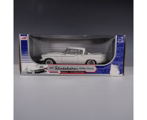 A highly detailed 1:18 scale die-cast model of the 1957 Studebaker Golden Hawk from the Anson Collection. This collectible mo