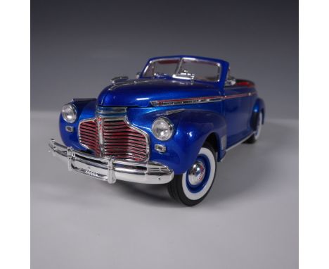 A highly detailed Welly 1/18 scale diecast model of the 1941 Chevrolet Special Deluxe, featuring a striking metallic blue ext