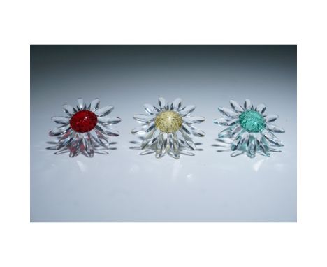 A set of three Swarovski SCS Renewal Gift crystal flowers, issued as membership renewal gifts for the Swarovski Crystal Socie