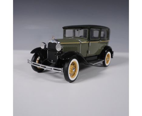 This 1:18 scale diecast model of the 1930 Ford Model A by Signature Models is a highly detailed replica featuring an olive gr