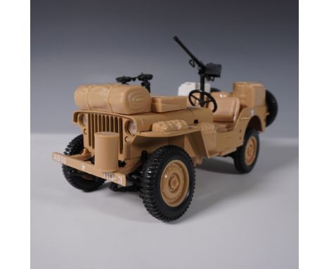 A highly detailed 1:18 scale diecast model of the iconic Jeep Willys by Solido. Finished in a desert tan military scheme, thi